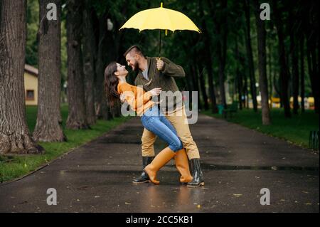 Happy love couple dancing in summer rainy day Stock Photo