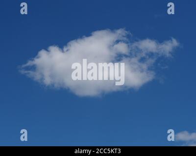 single white fluffy cloud in blue sky Stock Photo