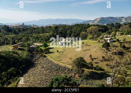 Overview of almost entire entrance and partial of the lavender field plantation of O Contemplario farm with the mountainous Cunha landscape at back. Stock Photo