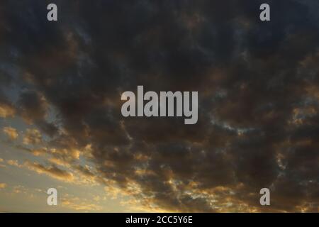 background dark cloudy sky in summer sunset Stock Photo