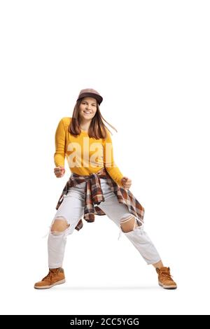 Full length shot of a young lady dancing street style isolated on white background Stock Photo