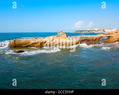 The rock of the Virgin or Le rocher de la Vierge is a tourist natural landmark in Biarritz city in France Stock Photo