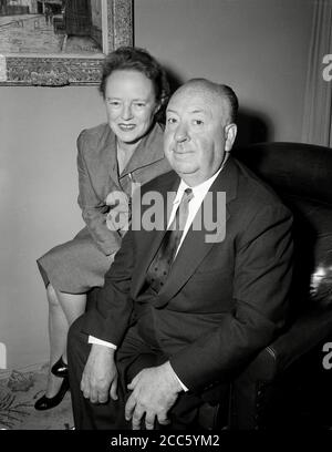 Film and television director Alfred Hitchcock, poses with his wife, Alma Reville, August 29, 1956  File Reference # 34000-265THA Stock Photo