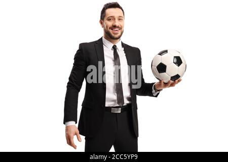 Professional man in a black suit holding a football isolated on white background Stock Photo