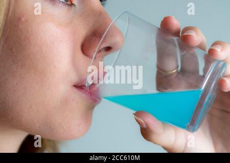 Bad breath, prevention through cleaning, mouth rinse, Stock Photo