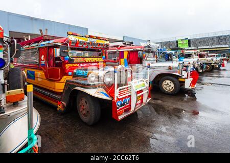 MANILA, PHILIPPINES - FEBRUARY 25, 2013: Jeepneys are popular public transport in the Philippines, they made from old US military jeeps Stock Photo