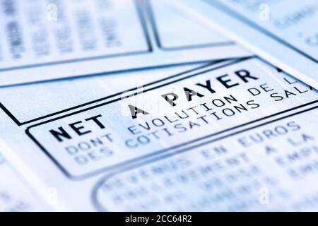 French payroll with income tax deduction. Close-up on the 'net salary' written in french ('net a payer') Stock Photo