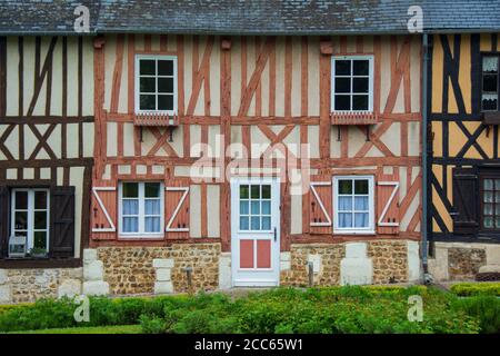 Facade of an old half-timbered house, typical Normandy style, close-up. Le Bec Hellouin, France Stock Photo