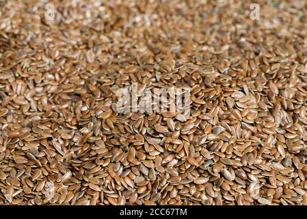 heap of brown flax seeds macro selective focus Stock Photo