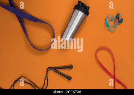 gym equipment laid out on a yoga matt in a home gym Stock Photo