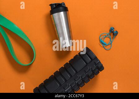 gym equipment laid out on a yoga matt in a home gym Stock Photo