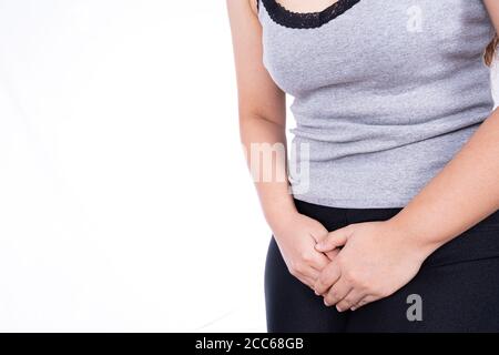 Woman holding hand on her crotch Stock Photo - Alamy