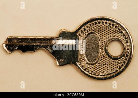 Very small padlock switch. Key for padlock. Mini key to lock and unlock. Memory book key. Stock Photo