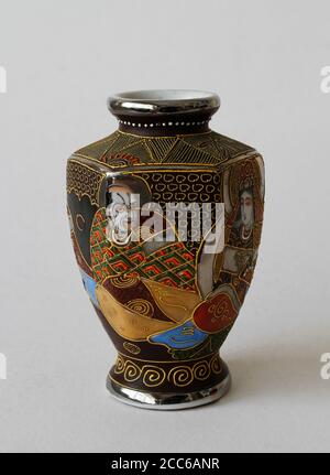 An ornamental cup made of ceramics, hand painted. Decorative cup that can also be used as a vase. Ceramic cup, which can also be used for home decorat Stock Photo
