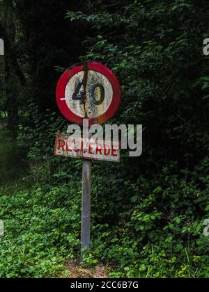 old traffic sign on a mountain road Stock Photo