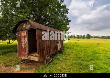 An old rusty Shepherd's Hut in the Worcestershire countryside, England Stock Photo