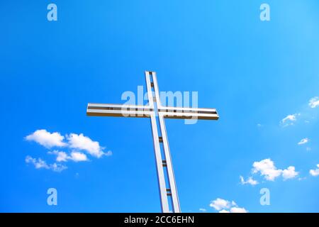 Religious Cross against blue sky Stock Photo
