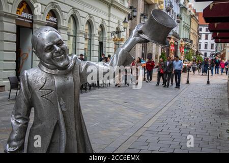 Bratislava, Slovakia - July 5th 2020: The Schone Naci, silver, bronze statue in Bratislava's old town, Slovakia Stock Photo