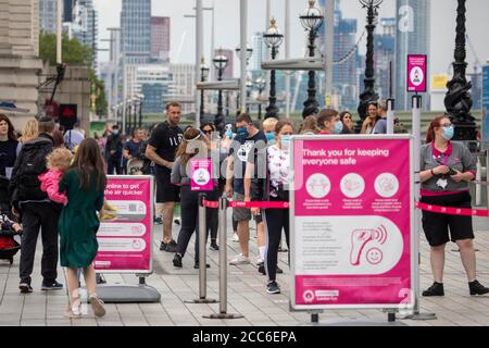 pic shows:   Temperature testing at the London Eye today  Monday 17th August 2020 (corrected)   Attractions have been open for a week but number and q Stock Photo