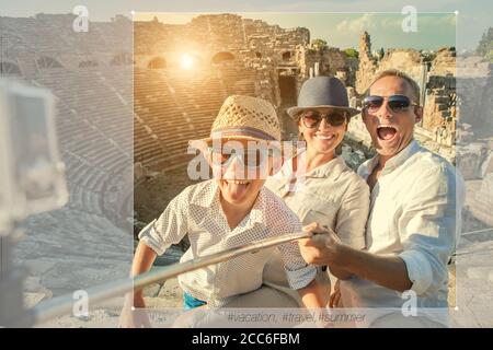 Young positive famly take a vacation photo on the Side ampitheatre view Stock Photo