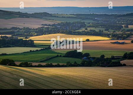 Looking out over a South Downs landscape from Firle Beacon, with evening light Stock Photo