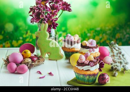 Closeup of Easter cupcakes on white wooden background Stock Photo