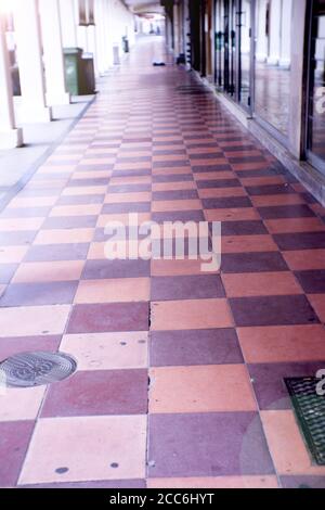 Street flooring in squares of reddish and purple colors. No people Stock Photo