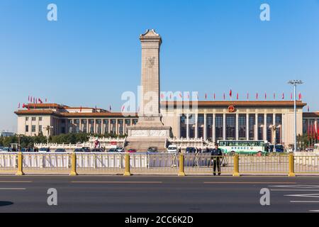 Beijing, China - October 14, 2014 - Security Guards standing on Tiananmen Square before the Monument to the People's Heroes and the Great Hall of the Stock Photo