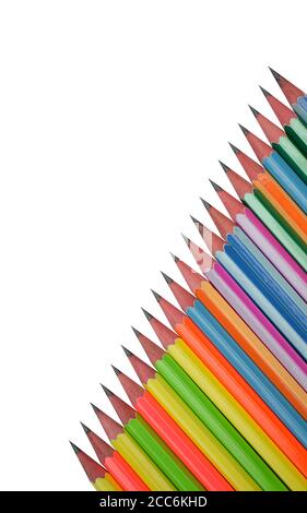 Single line of different colored wood pencil crayons placed on an isolated white paper background Stock Photo