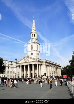 London, UK - September 1, 2010:  St Martin In The Fields in Trafalgar Square with tourists which is a popular travel destination tourist attraction la Stock Photo