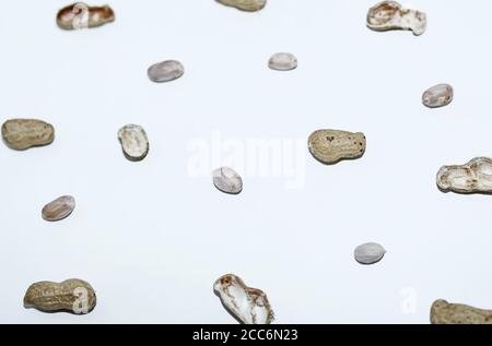 Top view of Peanuts hulls nut shell and peeled peanuts isolated on white backgrounds Stock Photo