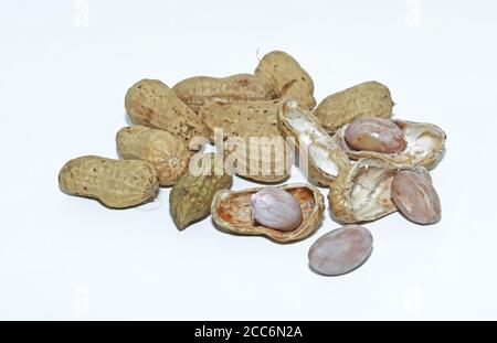 Organic peanuts in shell isolated on white background. Heap of peanut closeups Stock Photo