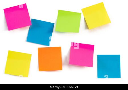 Colorful Adhesive Notes Isolated on White Wall Background. Close-up. Copy Space. Concept for Ideas or Messages. Stock Photo