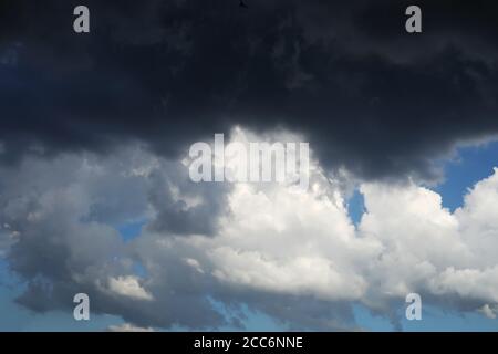 Black cloud and thunderstorm before rainy, Dramatic black cloud and dark sky Stock Photo