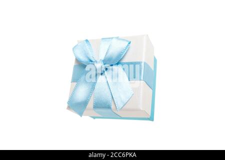 Gift box with a bow for rings in a delicate color of blue and beige. Surprise for a birthday party, a christmas event and congratulations. Close-up st Stock Photo