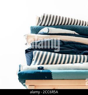 Towels, blankets and other home textile in blue and beidge colors Stock Photo