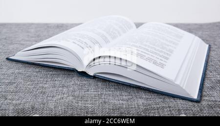 new open book on a gray table close up Stock Photo