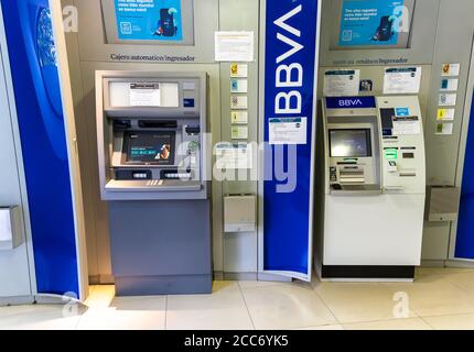 Huelva, Spain - August 16, 2020: Various ATM machines of BBVA  bank (Banco Bilbao Vizcaya Argentaria)  in the town of Valverde del Camino, Huelva, Spa Stock Photo