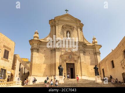 Victoria, Malta - August 3, 2019 -  Tourists visiting the Cathedral of the Assumption in the Cittadella of Victoria in Gozo, Malta Stock Photo