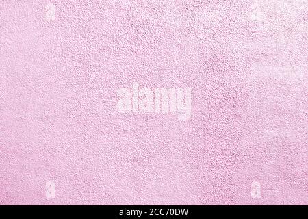 Pink wall of the building. Rough plaster surface. Abstract background. Stock Photo
