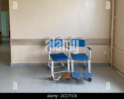 Two wheelchairs in the corridor of the hospital, copy space for text Stock Photo