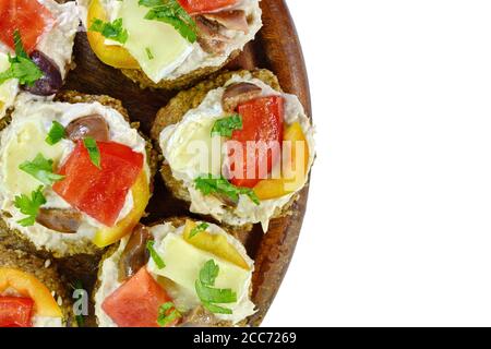 Delicious Appetizer Canapes with pheasant pate, cheese, paprika and tomatoes Isolated over White. Stock Photo