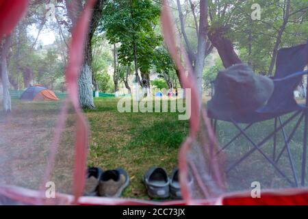 View of the campsite from inside the tent Stock Photo