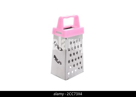 A metal grater with a pink plastic handle for chopping food and vegetables when cooking. Close-up studio shot on white background isolate. Stock Photo