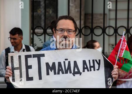 A man stands in a single picket in support of the President of the Republic of Belarus Alexander Lukashenko on Maroseyka street in front of the Embassy of the Republic of Belarus in Moscow, Russia. The banner reads "No to Maidan" Stock Photo