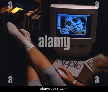 Daytona Beach, FL-circa January 1996:  Doing homework on an early model Apple computer Stock Photo