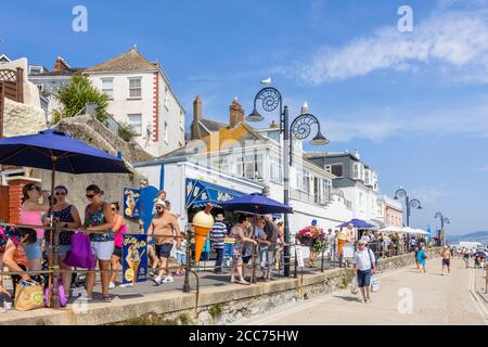 Busy Marine Parade seafront promenade at Lyme Regis, a popular seaside town holiday resort on the Jurassic Coast in Dorset, south-west England Stock Photo