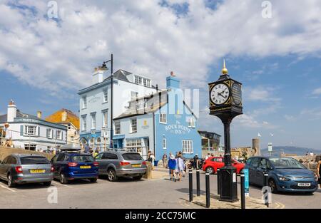 The Rock Point Inn and Town Clock on the seafront at Lyme Regis, a popular seaside town holiday resort on the Jurassic Coast in Dorset, SW England Stock Photo