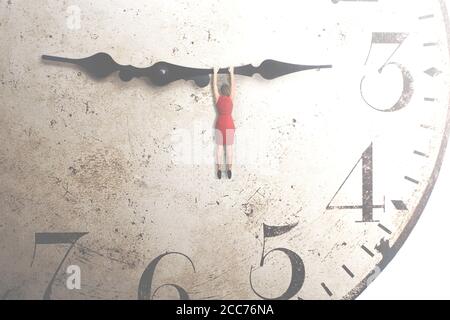 business woman trying to stop the time hanging on the hand of a clock Stock Photo