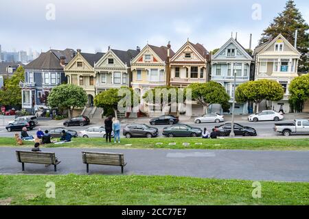 Painted Ladies in San Francisco, CA,  historical row of Victorian houses colorfully painted in 3 or more colors to enhance the architectural details Stock Photo